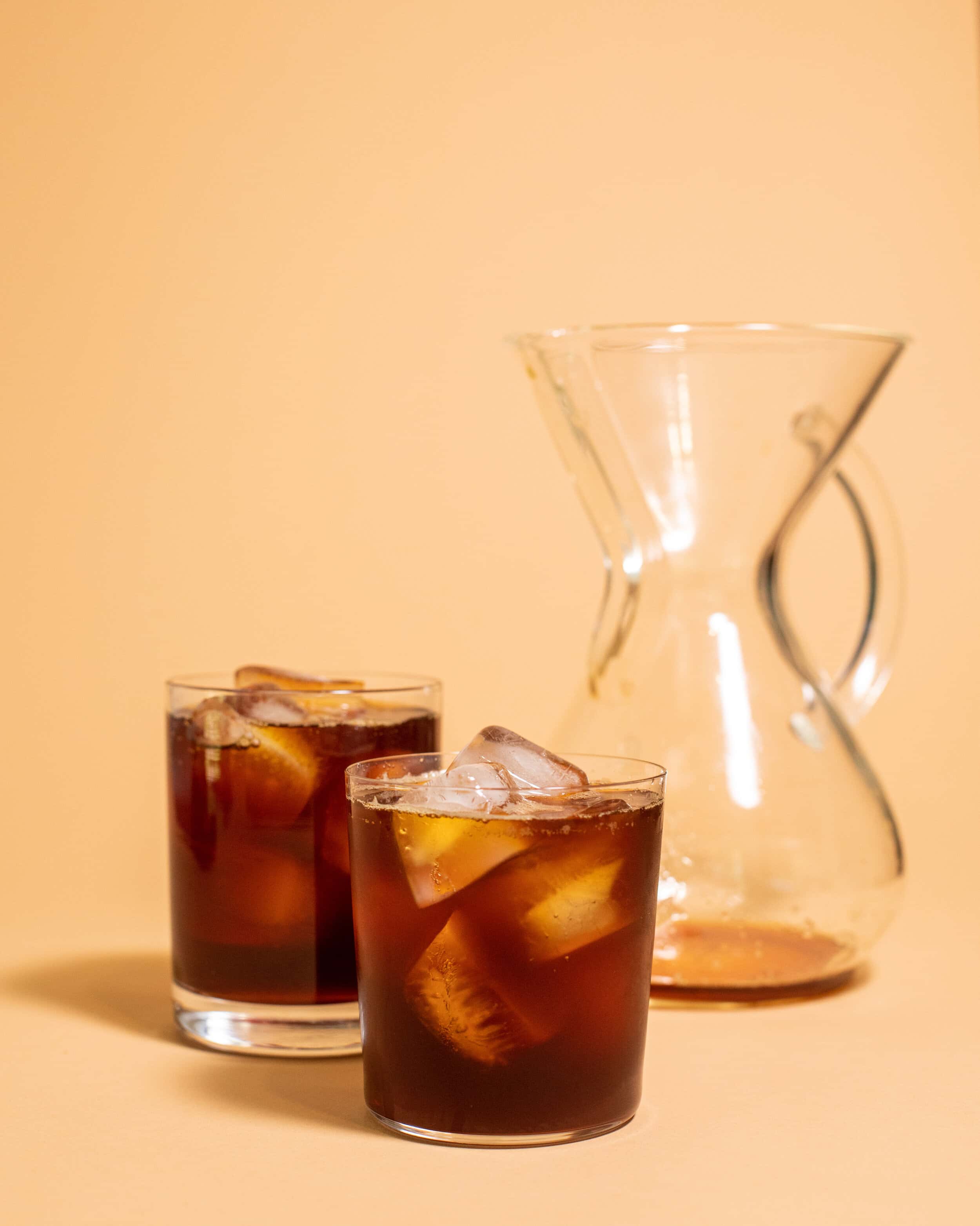 chemex with 2 glasses of iced coffee next to it